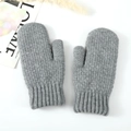Detail of warm grey knit mittens featuring a vertical ribbed cuff and thick texture - Light Gray