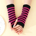 Trendy pink and black striped knit fingerless arm warmers for stylish winter warmth - One Size / Black + Rose Pink