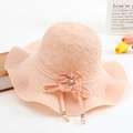 Pink wavy knit sun hat with floral pearl detail and wide brim for beach sun protection - One Size / Pink