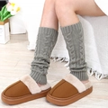 Thick cable knit leg warmers in grey paired with warm plush slippers for winter comfort - One Size / Light Gray