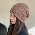 Stylish brown slouchy knit beanie featuring an intricate openwork pattern and warm texture - Khaki