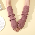 Long pink knitted arm warmers in a ribbed style with y2k slouchy fingerless design - Pink
