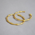 Elegant gold bamboo-joint C-shaped hoop earrings made of matte finish stainless steel - Vintage Frosted Gold
