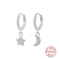 Detailed view of S925 sterling silver star and moon earrings with pavé cubic zirconia - Silver-White Zircon