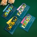 Detailed macro of hollow brass floral bookmarks with elegant silk tassels and backing - Rose Sunflower Hydrangea And Tulip Group