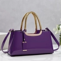 Detail of purple patent leather handbag with gold textured handle and adjustable strap - Purple / 34*11*16CM