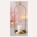 Grande portacandele a lanterna in metallo dorato con vetro e manico decorativo - Oro Grande