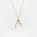 Macro shot of gold letter A pendant with colorful zircon stones on fine chain - Gold A