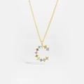 Detail of golden letter C pendant with multi-color cubic zirconia on a fine chain - Gold C