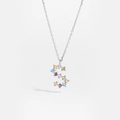 Macro shot of silver S-letter pendant featuring vibrant multi-colored cubic zirconia gems - Gold S