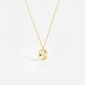 Macro shot of gold constellation necklace with colorful zircons on white background - Leo