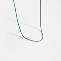 Détail du collier tennis en argent S925 avec petites pierres d'émeraude verte ronde - Platine Pierre Verte