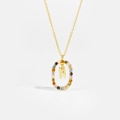 Macro shot of 925 silver necklace with letter N pendant and colorful zircon stones - Letter N