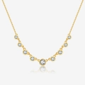Detail of gold necklace featuring nine graduated bezel-set clear round gemstones - 925 Silver / 18K Gold