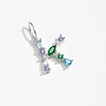 Macro shot of silver letter K pendant set with colorful mixed-cut cubic zirconia gems - Letter K / Platinum