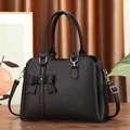 Elegant black lychee textured handbag with bow decoration and gold metal hardware - 31*13*23 / Black