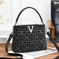 Fashionable black faux leather handbag with silver rhinestone grid and metal V logo - Black