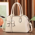 Elegant cream lychee textured handbag with a decorative bow and detachable shoulder strap - 31*13*23 / Off White