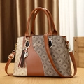 Elegante borsa a mano in pelle patchwork con motivi vintage e ciondolo a volpe e nappa - Grande / Marrone