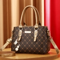 Brown handbag with golden M patterns, pearl charm, and adjustable strap - Coffee and Gold