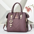Deep purple faux leather boston bag with woven texture, gold zip and pearl charm - Purple