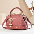 Pink lychee grain leather crossbody bag with top handle and pearl joy charm detail - 25*13*15 / Pink