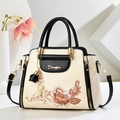 Elegant beige PU leather tote bag with floral embroidery and tassel charm - Black