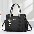 Minimalist black tote bag with woven texture, V-quilting, and gold pearl charm - Quilted Style / Black
