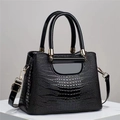 Polished black crocodile pattern leather handbag with gold hardware and top handles - Black