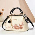 Elegante beige Stickerei Handtasche mit schwarzen Henkeln und Blumenmuster - Schwarz