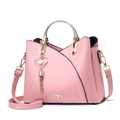 Detailed view of pink crossbody bag with metal ring handle and heart pearl charm - Pink