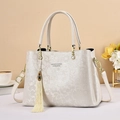 Elegant off-white floral embossed handbag with tassel charm and gold hardware - 28cmx13cmx19cm / White