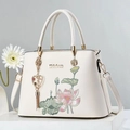 Elegant white tote bag with lotus embroidery, gold chain, and tassel decoration - Off White