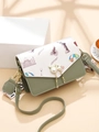 Green and white patchwork crossbody bag with architectural print and cat-shaped pearl charm - Green