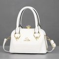 White patent leather handbag with gold cat logo and crystal clasp for elegant evening use - One Size / White