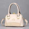 Glossy apricot patent leather handbag with gold logo and crystal top closure detail - One Size / Khaki
