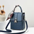 Mini navy blue crossbody bag with woven texture, golden lock and silk scarf handle decor - Blue