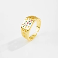 Macro detail of S925 hallmark on gold celestial ring with colorful zircon inlay - 18K Gold