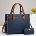 Detail of navy blue pebble grain handbag with brown handles and matching card holder - Dark Blue