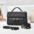 Detail of black Saffiano leather crossbody bag with gold zippers and two straps - Black / 21*8*13