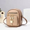 Detail of light brown faux leather mini backpack with gold cat charm and dual zip texture - 16*9*20 / Khaki