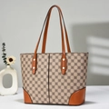 Detail of vintage tote bag with canvas geometric pattern and brown leather straps - Khaki
