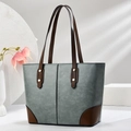 Large gray-blue tote bag with brown trim and golden studs on minimalist studio background - 30cm x 12cm x 25cm / Green