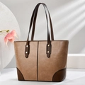 Macro detail of brown PU leather tote bag with gold rivets and reinforced corner stitching - 30cm x 12cm x 25cm / Khaki