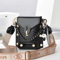 Fashionable black crocodile embossed mini crossbody bag with wide strap and panda charm - Black