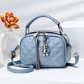 Light blue quilted leather mini crossbody bag with silver bear charm and tassel - Blue
