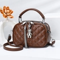 Brown quilted crossbody bag with silver bear charm and detachable adjustable strap - Coffee