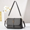 Sleek dark grey textured crossbody bag with gold metallic buckle and adjustable strap - Style 2 (Interlocking Square Buckle) / Gray