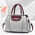 Elegante bolso de mano bicolor en cuero sintético gris y burdeos con detalles dorados - Gris