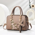 Elegant brown leather handbag with floral embroidery and gold butterfly charm - Khaki
